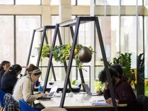 students working at a desk in the Manor Road Building